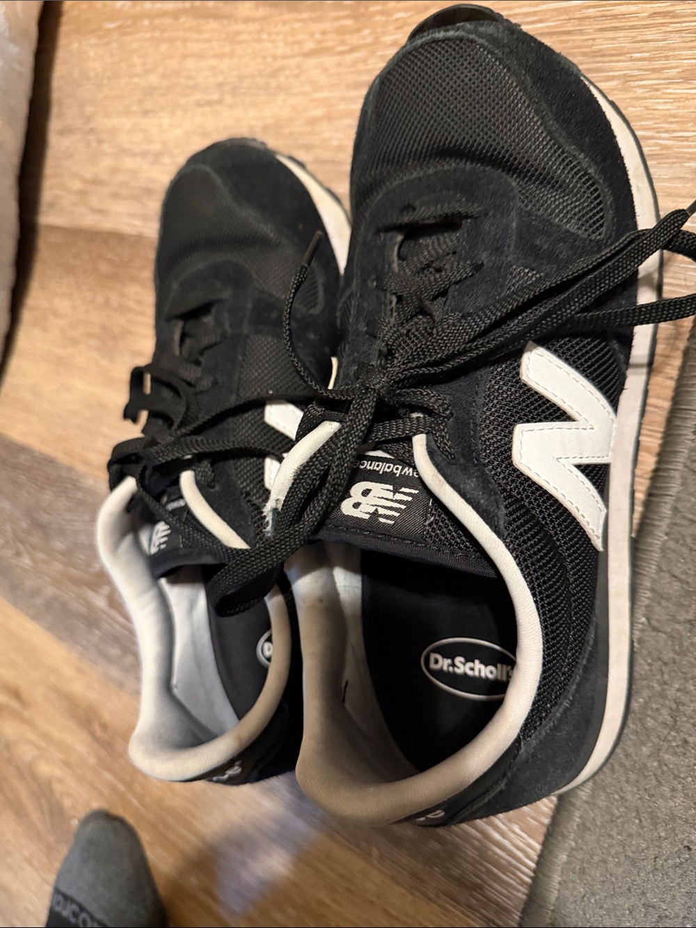 New Balance Women’s Black and White Logo Sneakers